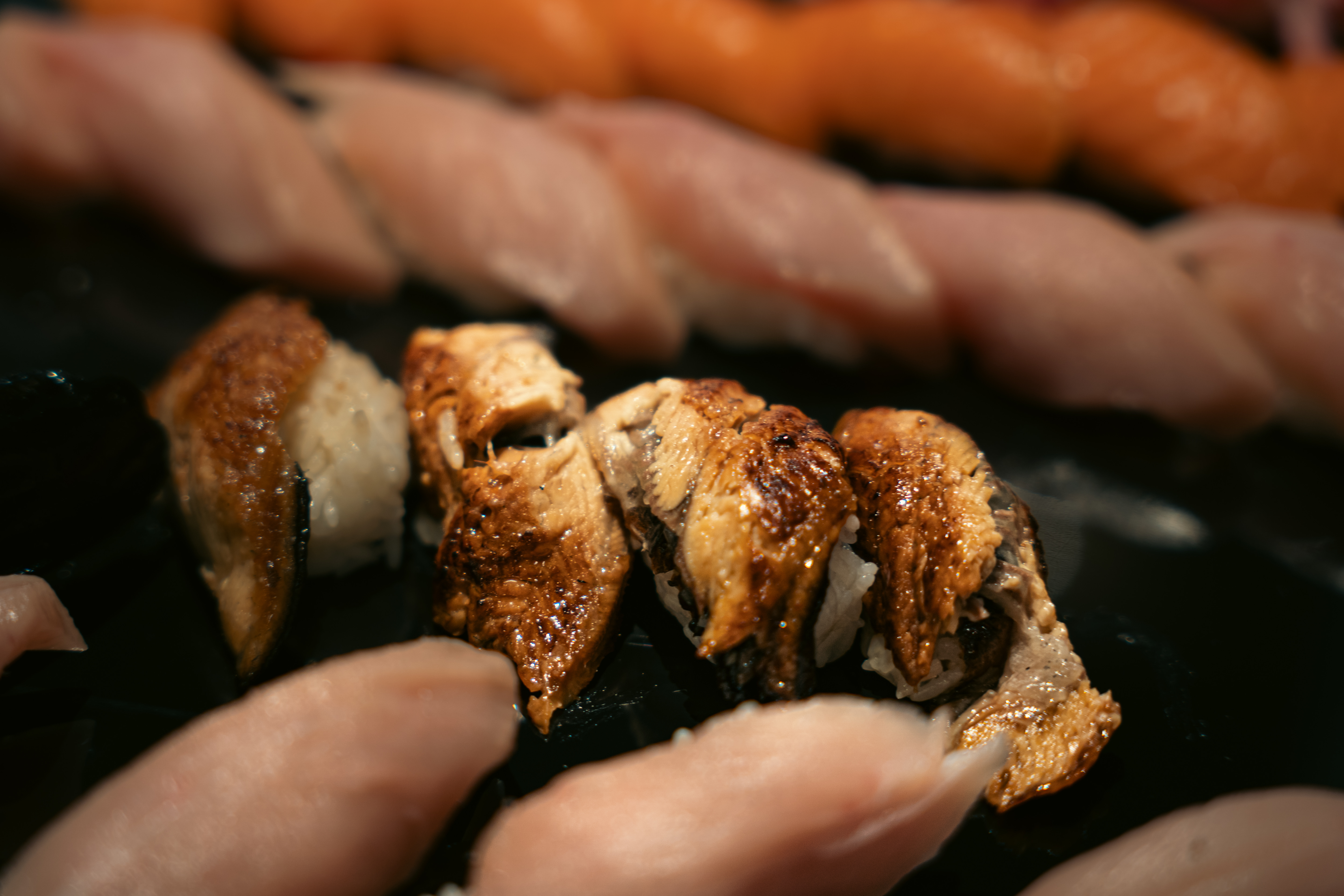 Premium unagi and salmon nigiri at Ju Sushi & Lounge